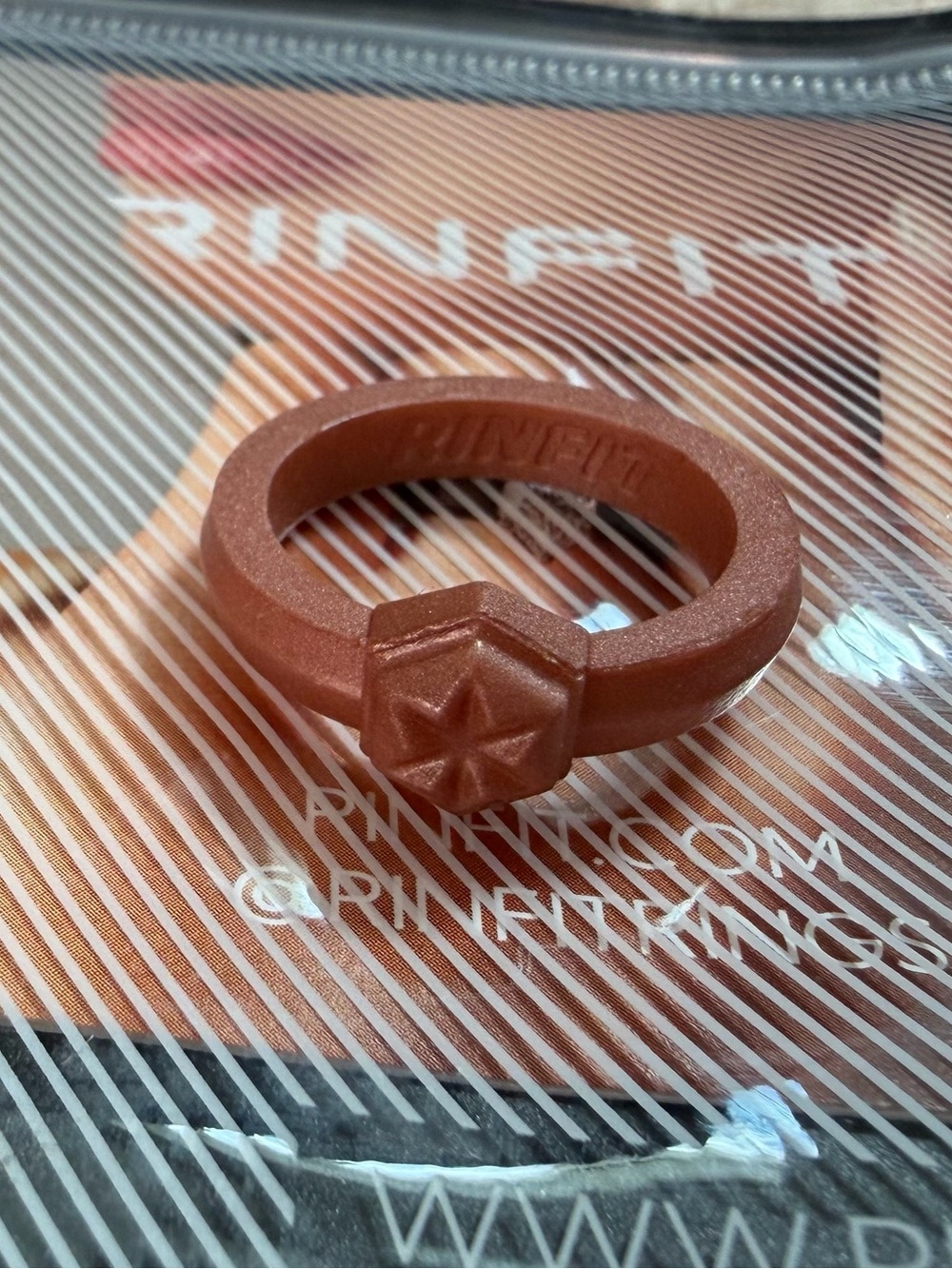 Rinfit silicone star ring, size 6, “rose gold” engagement style